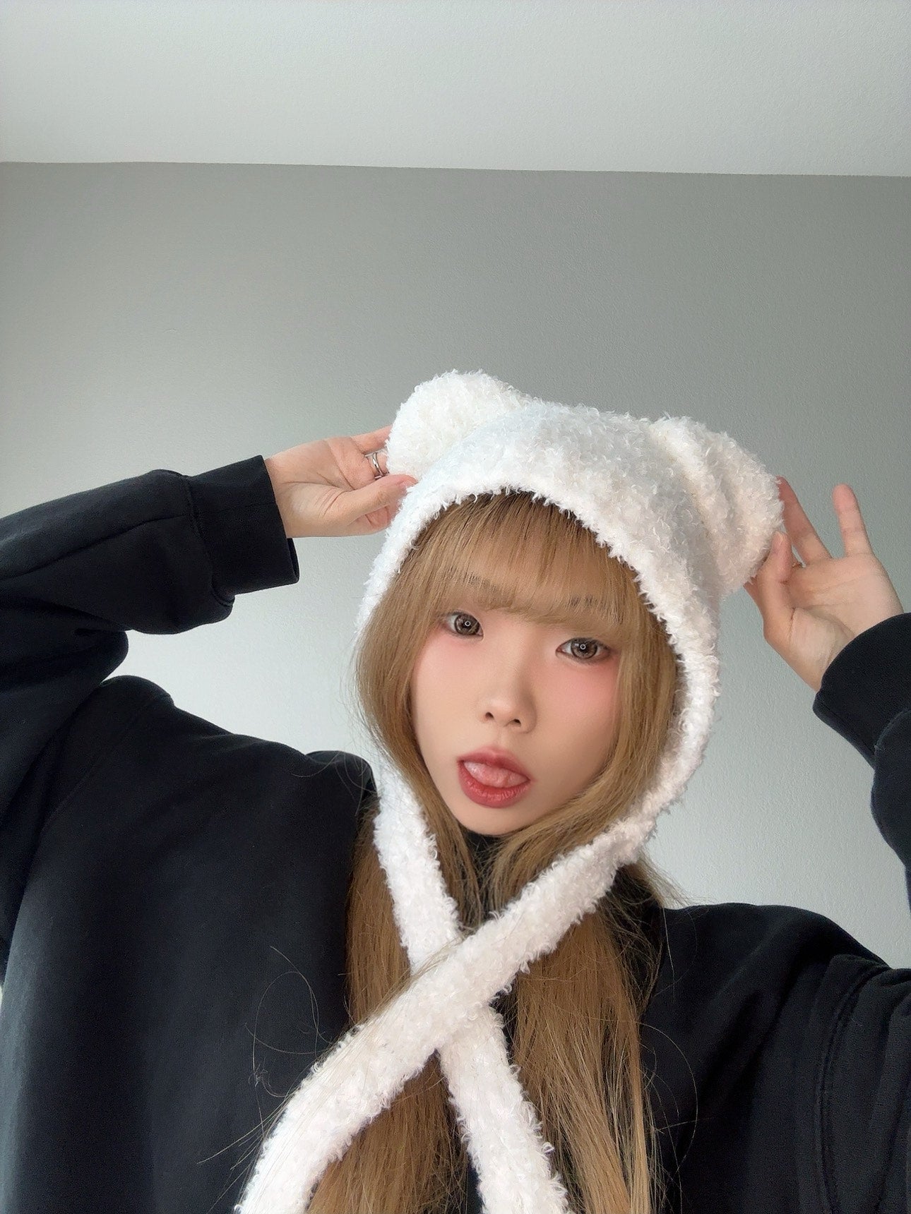 White Fuzzy Bear Hat – Cute Winter Tie Beanie with black sweater.
